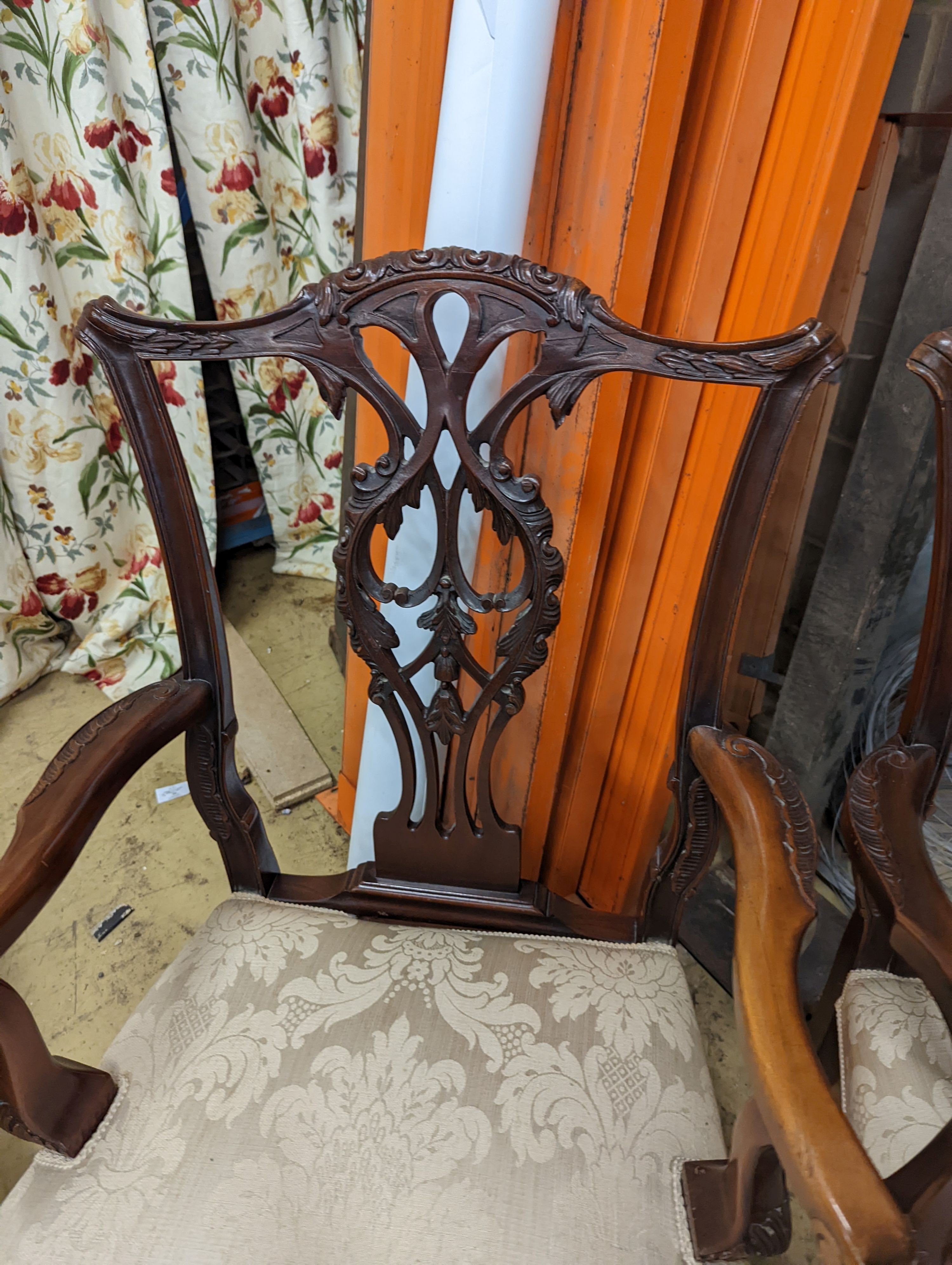 A pair of Chippendale revival mahogany elbow chairs, width 60cm, depth 50cm, height 102cm